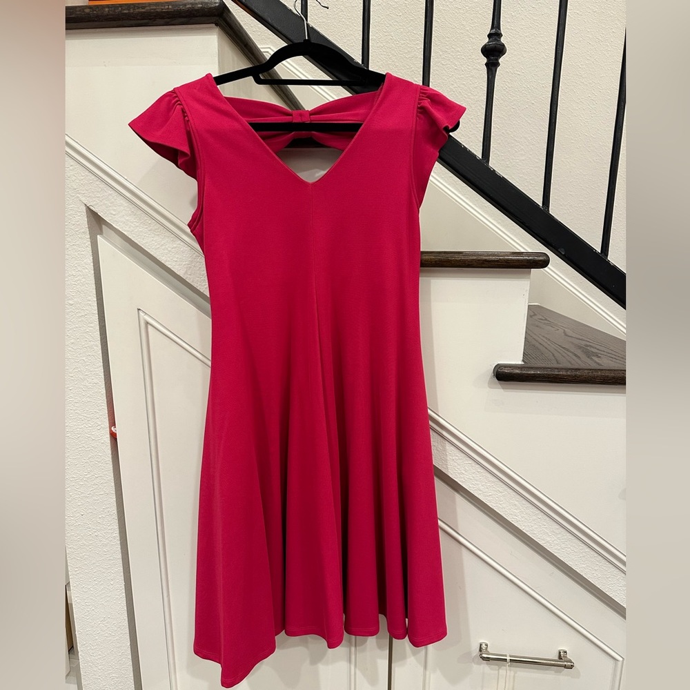 NWT Magenta pink dress with cut outs in the back.